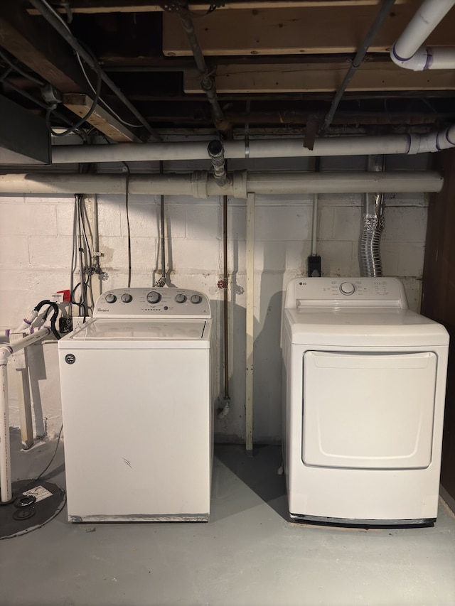 clothes washing area with washer and dryer