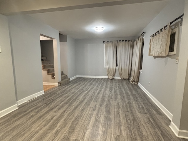 empty room featuring dark hardwood / wood-style flooring