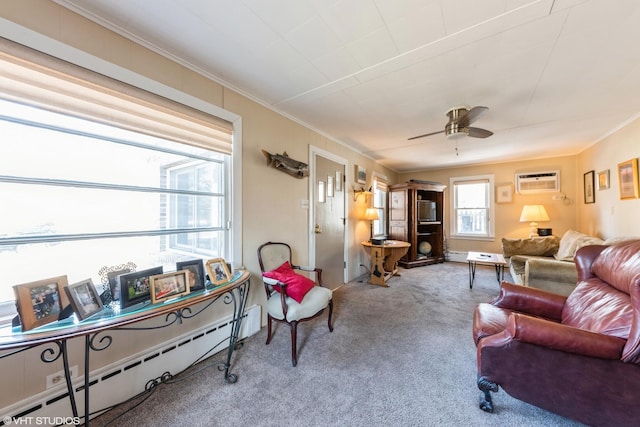 living room with crown molding, a baseboard radiator, carpet flooring, and ceiling fan