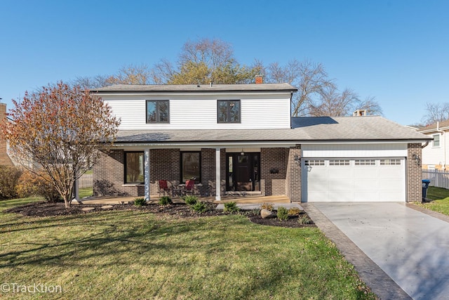 view of property featuring a front yard, a porch, and a garage