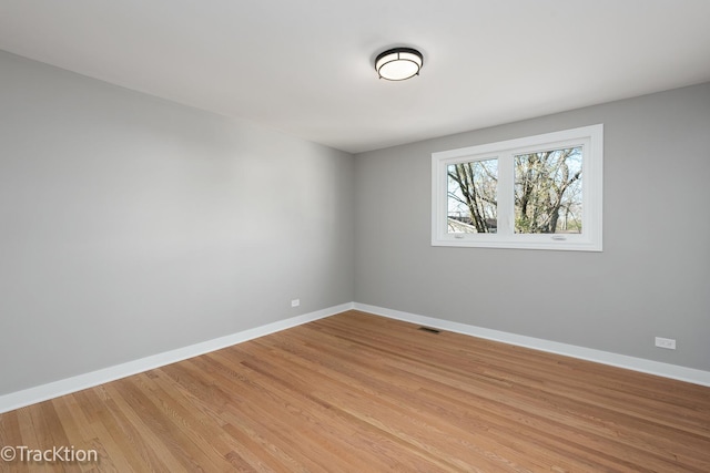 unfurnished room featuring light hardwood / wood-style flooring