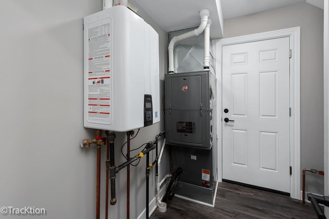 utility room featuring water heater