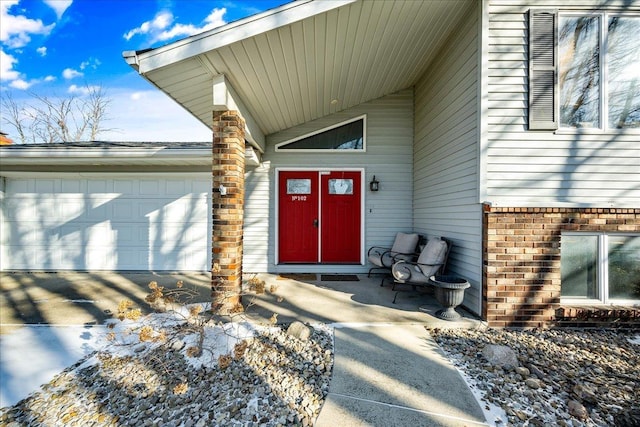 view of exterior entry featuring a garage