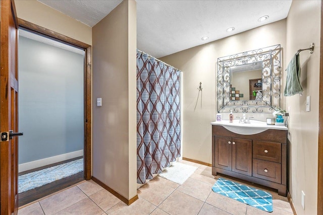 bathroom with vanity and tile patterned flooring