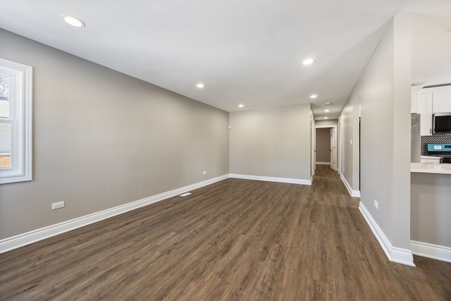 spare room featuring dark hardwood / wood-style flooring