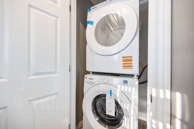 laundry area featuring stacked washer and dryer