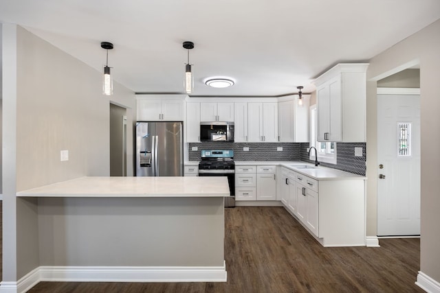 kitchen with white cabinetry, sink, decorative light fixtures, backsplash, and stainless steel appliances