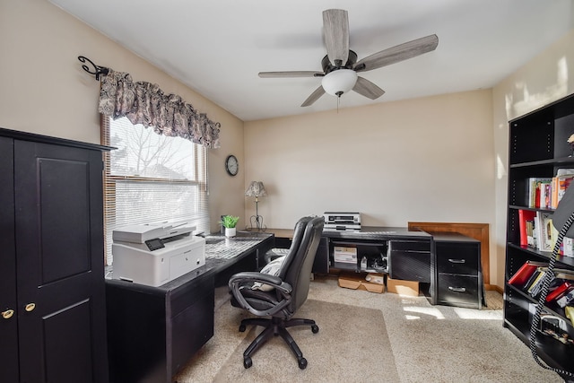 carpeted office with ceiling fan