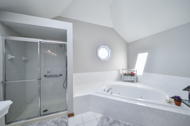 bathroom with tile patterned flooring, vaulted ceiling, and plus walk in shower