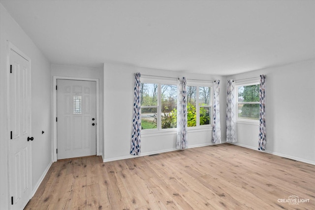 empty room with light wood-type flooring