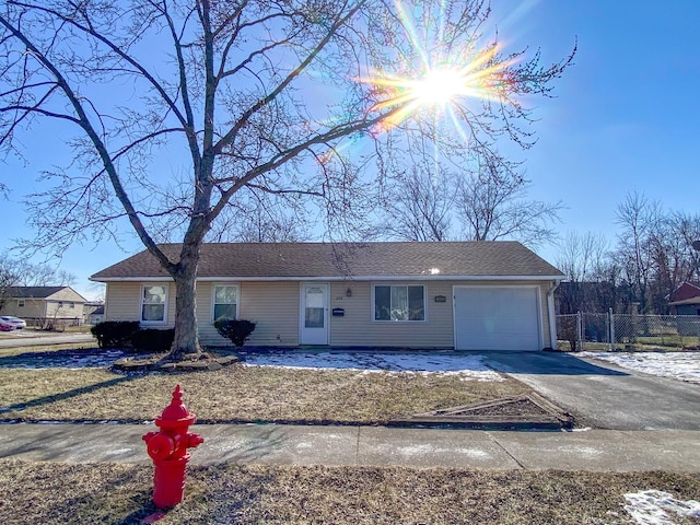 single story home featuring a garage