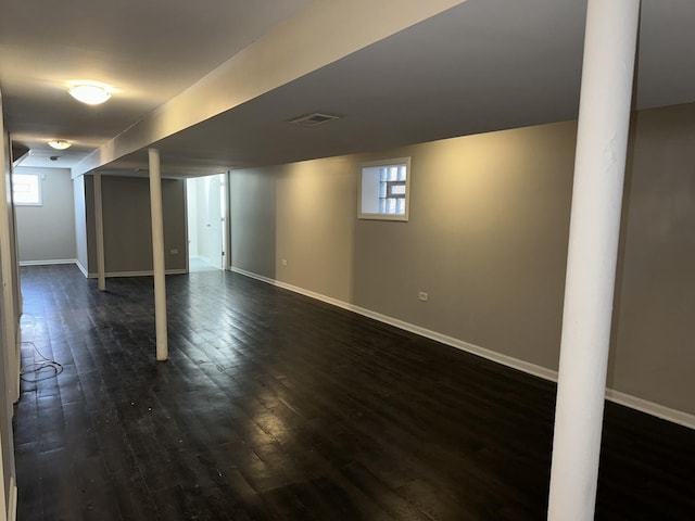 basement with dark wood-type flooring