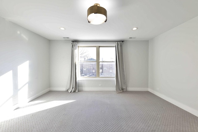 spare room with light carpet