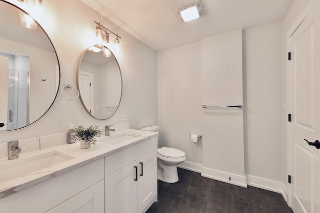 bathroom with toilet, a shower with door, and vanity