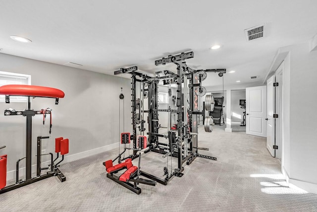 exercise room featuring light colored carpet