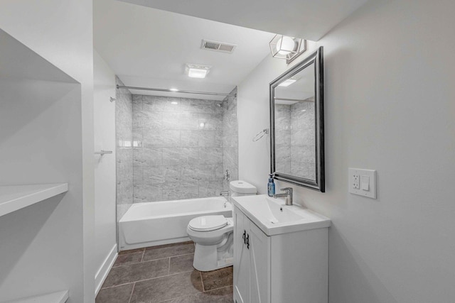 full bathroom featuring vanity, toilet, and tiled shower / bath