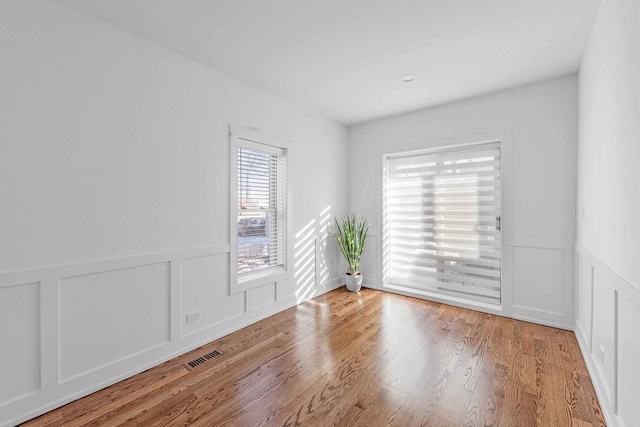 spare room with light wood-type flooring