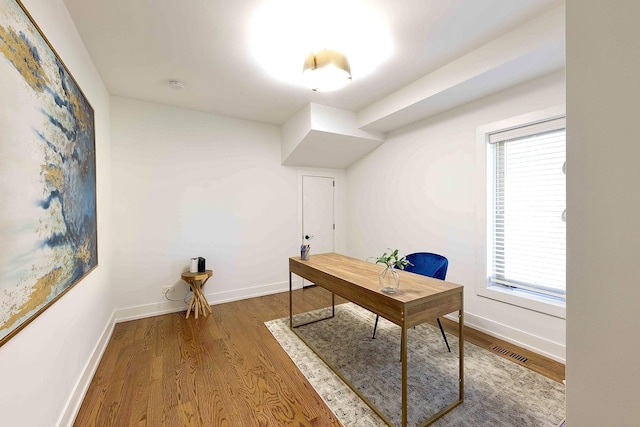 office space with hardwood / wood-style flooring