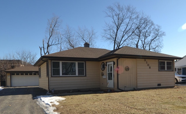 view of front of home with a garage and a front yard