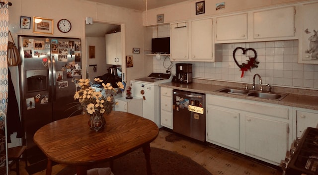 kitchen featuring stainless steel appliances, white cabinetry, sink, and backsplash