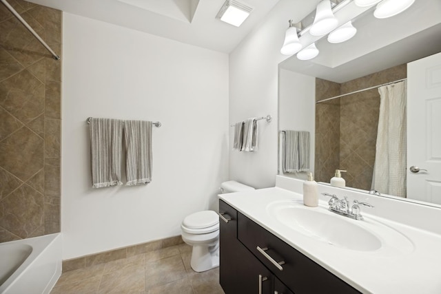 bathroom featuring tile patterned flooring, vanity, and toilet