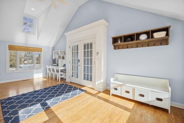 interior space featuring light hardwood / wood-style flooring, french doors, ceiling fan, and vaulted ceiling