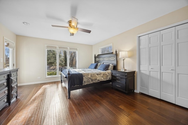 bedroom featuring ceiling fan, dark hardwood / wood-style flooring, and a closet