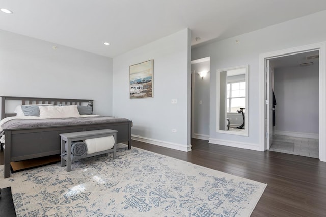 bedroom with dark hardwood / wood-style flooring