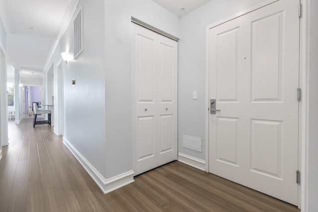 hallway with wood-type flooring