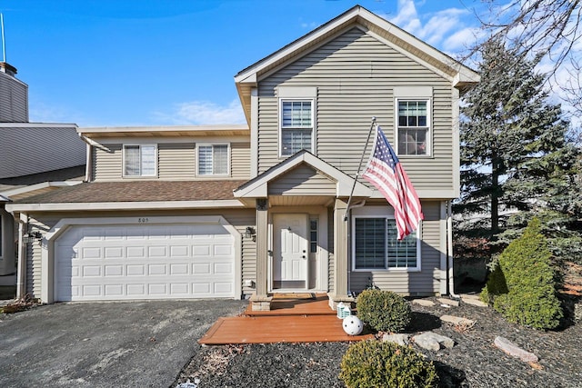 view of front of property with a garage