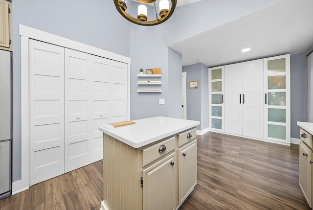 kitchen featuring dark hardwood / wood-style flooring, a chandelier, and a kitchen island