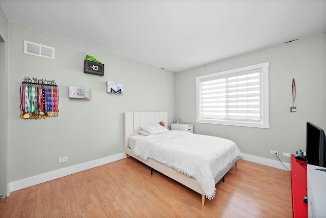 bedroom with wood-type flooring