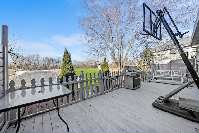 wooden terrace featuring a gazebo and area for grilling