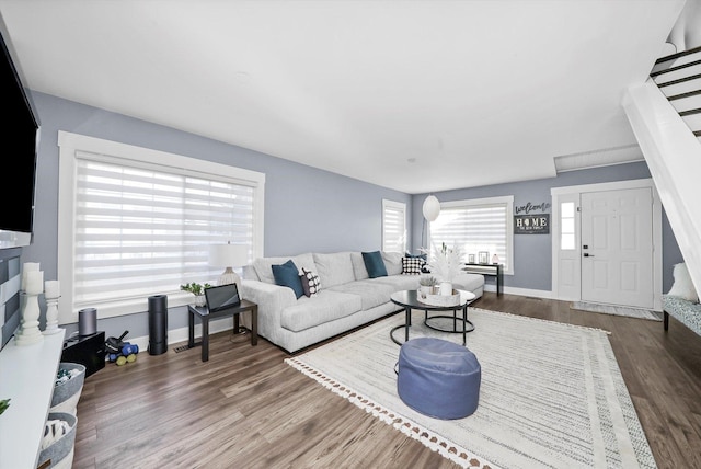 living room featuring dark wood-type flooring