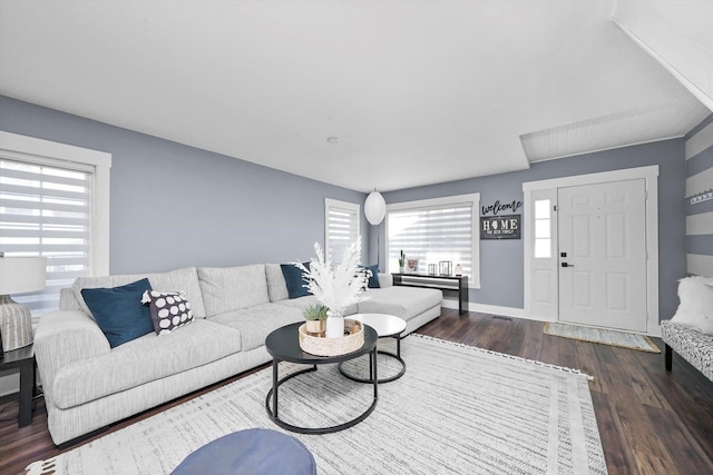 living room featuring dark wood-type flooring