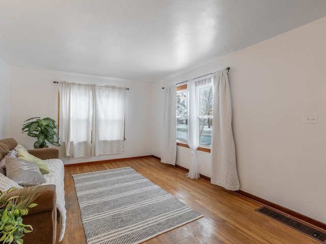 living room with light hardwood / wood-style floors