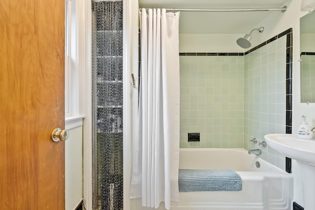 bathroom featuring shower / bath combo with shower curtain