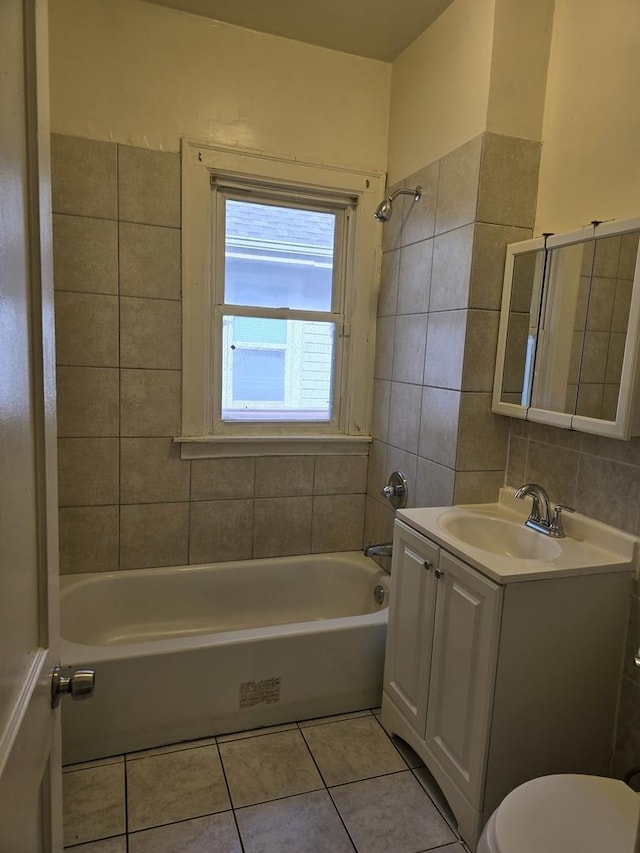 full bathroom with vanity, tub / shower combination, tile patterned floors, and toilet