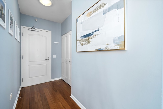 doorway with dark hardwood / wood-style floors