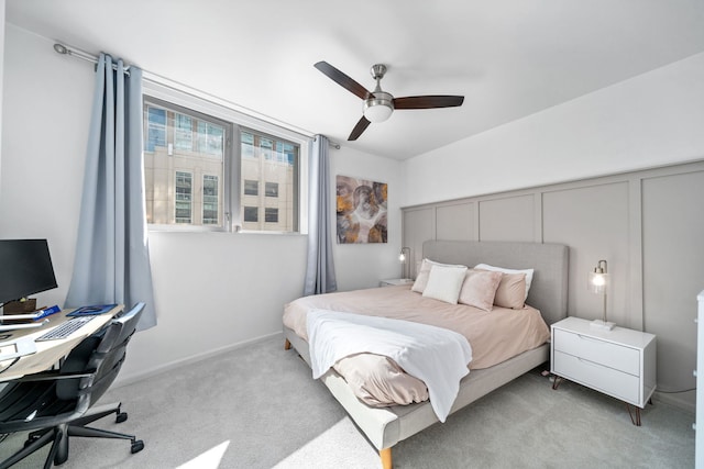 bedroom featuring ceiling fan and light colored carpet