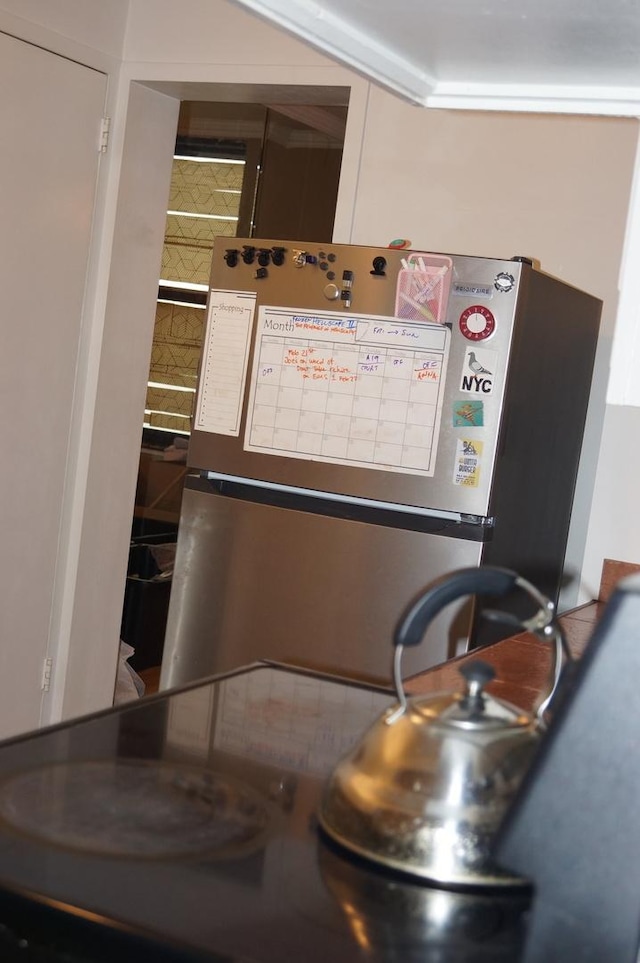 interior details with stainless steel fridge