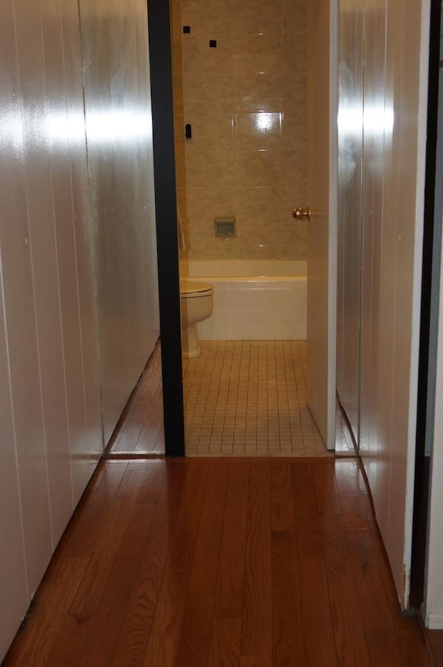 hallway with light hardwood / wood-style flooring