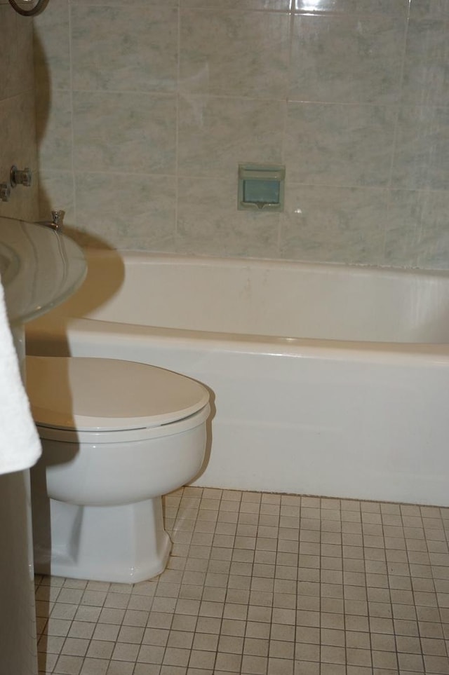 bathroom featuring tile patterned flooring and toilet