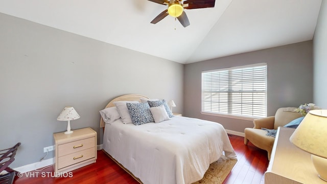 bedroom with vaulted ceiling, ceiling fan, and dark hardwood / wood-style flooring