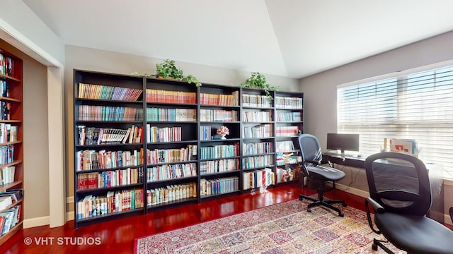 office space featuring vaulted ceiling and hardwood / wood-style flooring