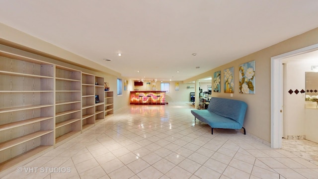 living area featuring light tile patterned floors