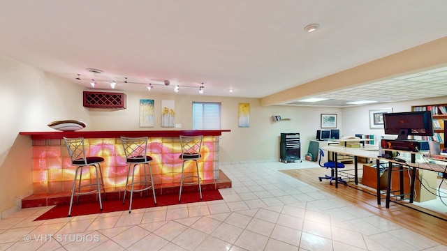 bar with light tile patterned floors