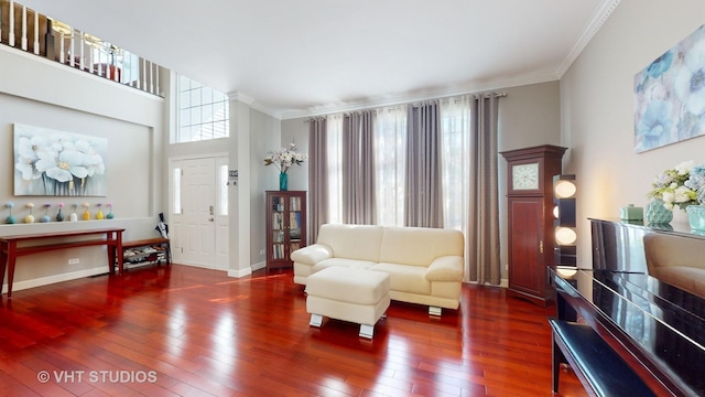 living room featuring plenty of natural light, dark hardwood / wood-style flooring, and crown molding