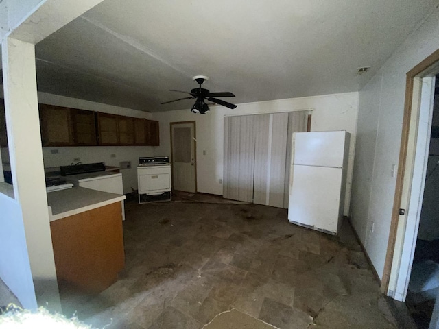 kitchen with range, ceiling fan, and white refrigerator