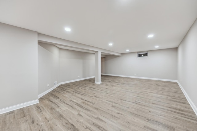 basement featuring light wood-type flooring